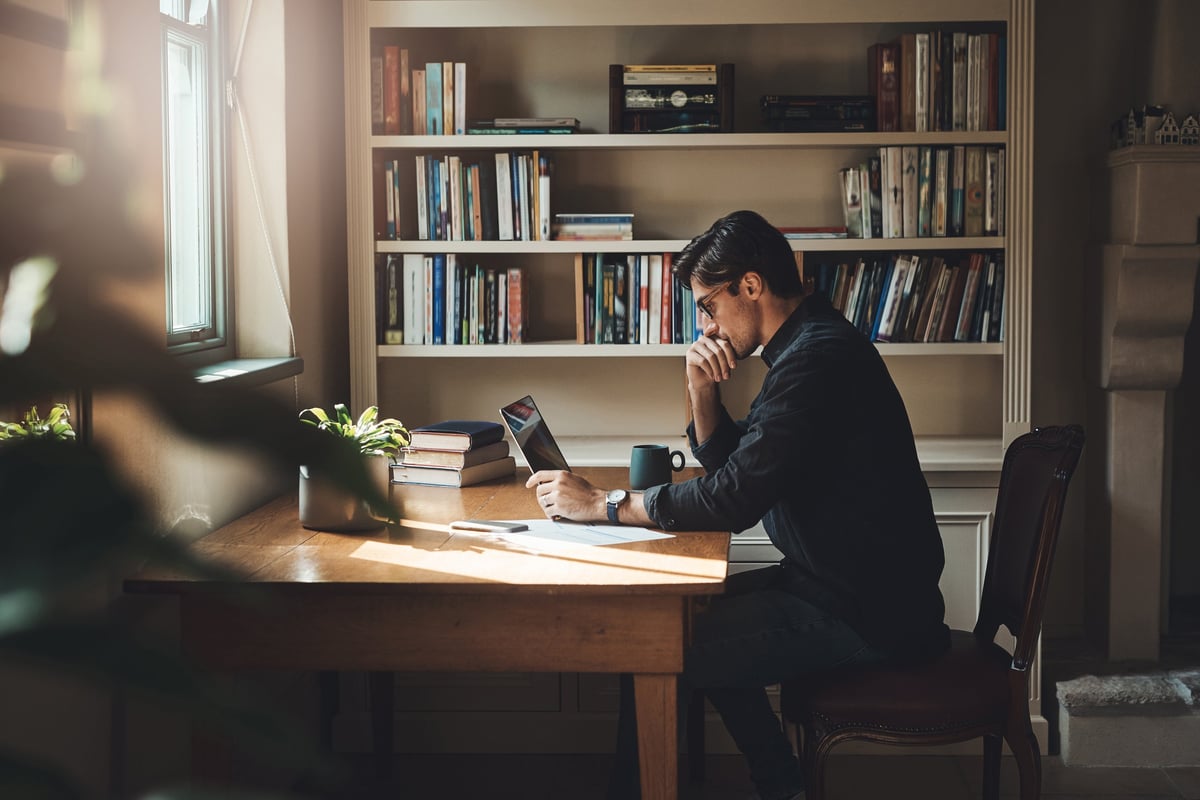 Man working from home office with styled background — great video call backdrop