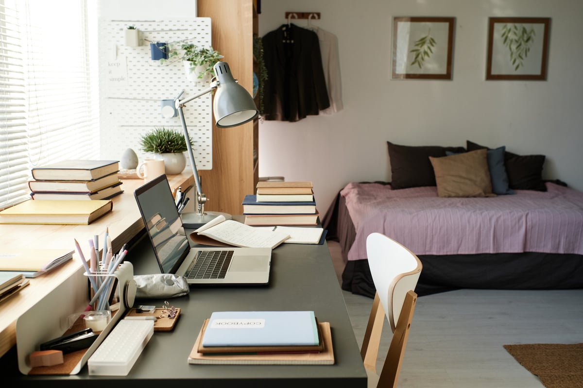 Warm bedroom interior with desk space near window