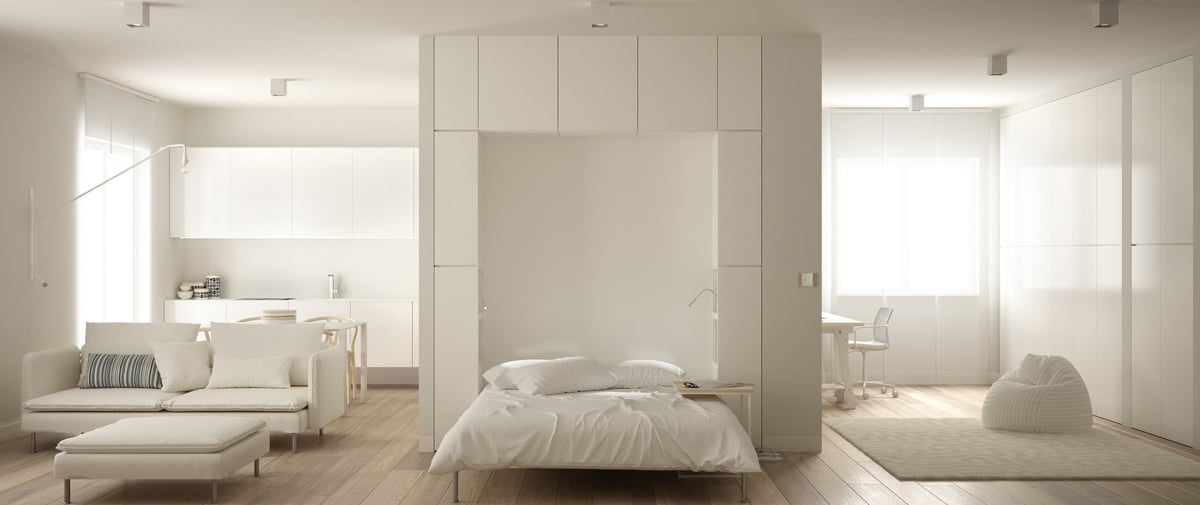 Murphy-style room with compact home office workspace, clean modern interior
