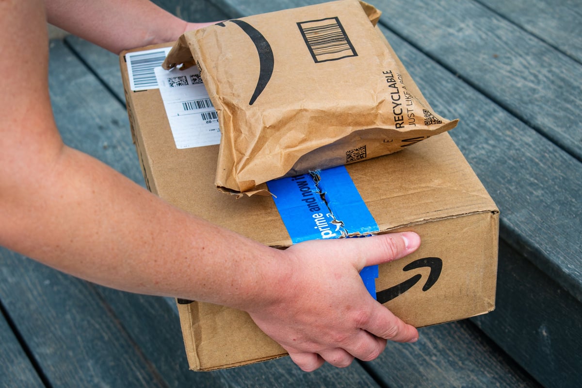 Amazon delivery packages on doorstep during daytime delivery