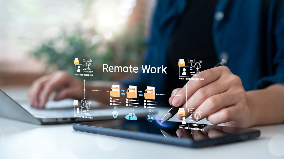 Freelancer working on laptop and tablet