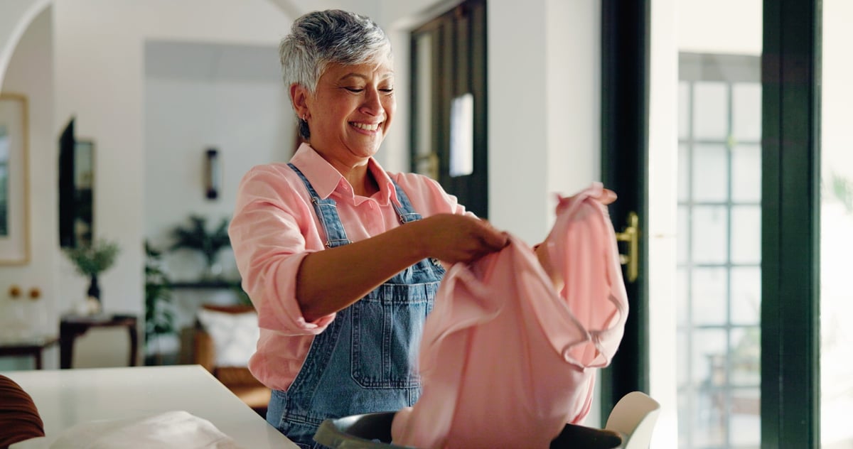 Person folding laundry at home