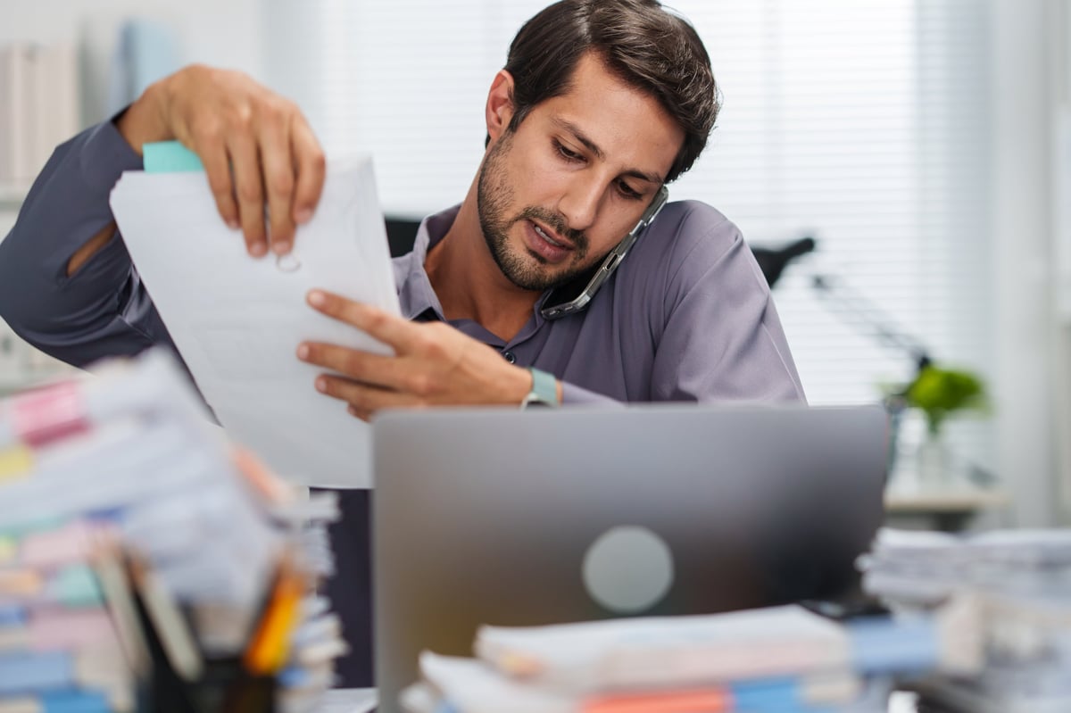 Busy person working on multiple tasks