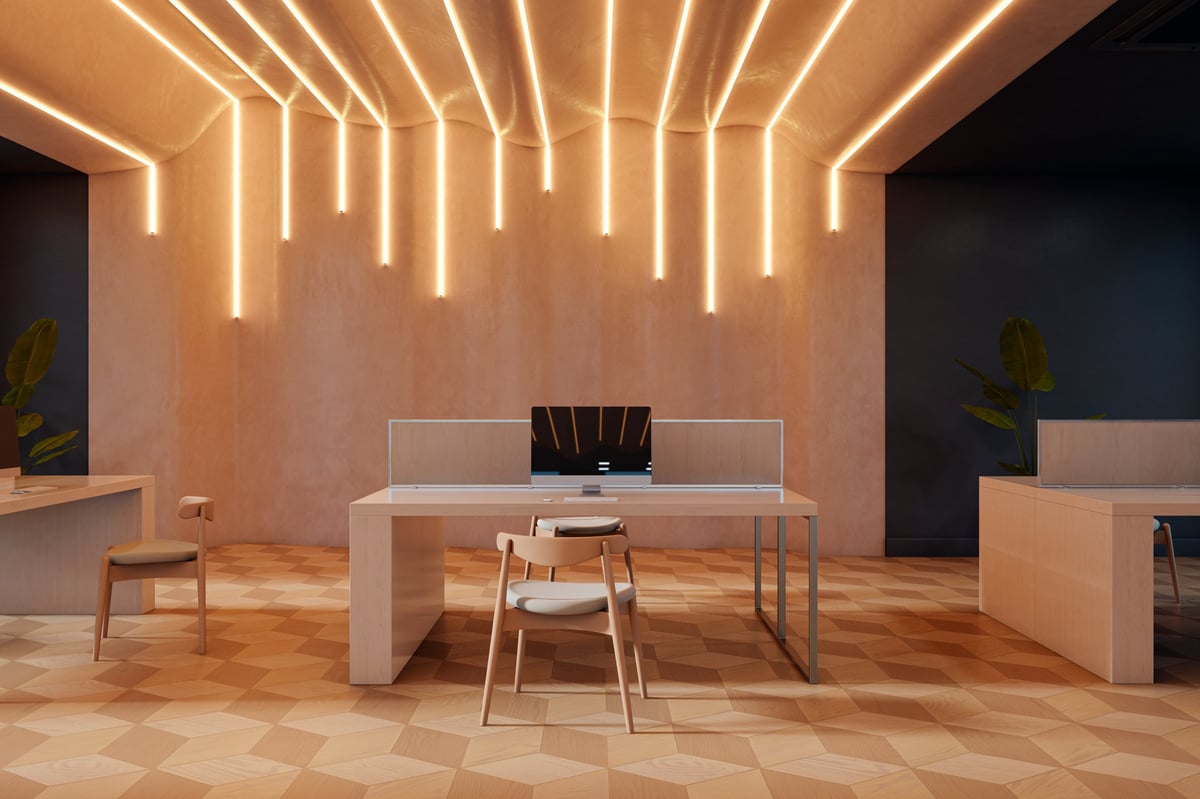 Minimalist modern workspace with clean wall, warm ambient lighting