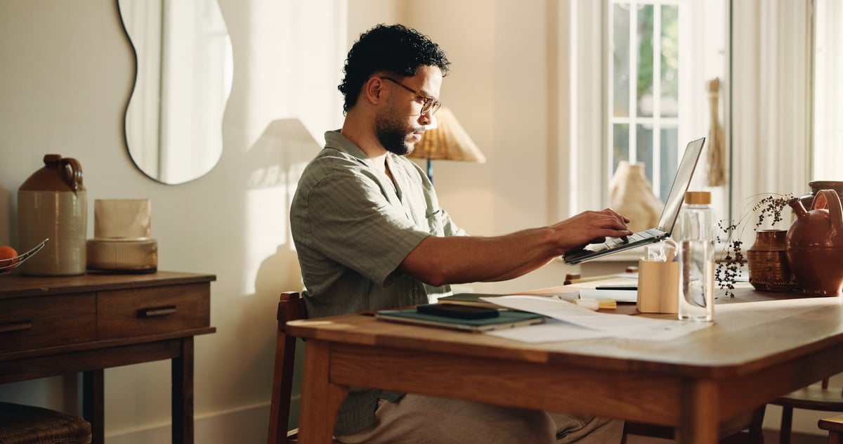 Person working creatively from home on a laptop