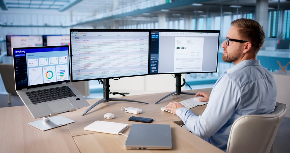 Dual monitor desk setup with professional workspace