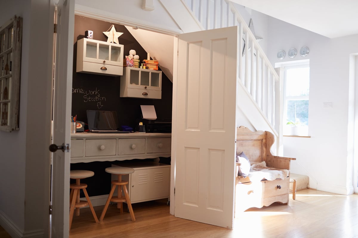 Under-stairs home office workspace in a contemporary family home