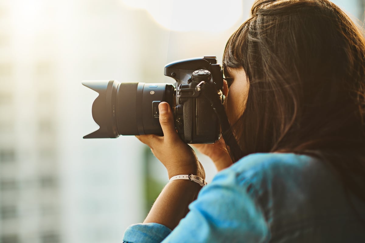 Photographer taking photos with professional camera
